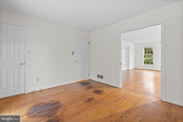 spare room featuring hardwood / wood-style flooring