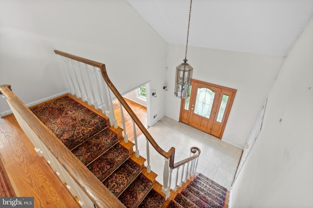 foyer entrance with high vaulted ceiling