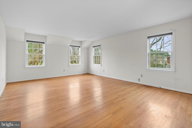 spare room featuring light hardwood / wood-style floors