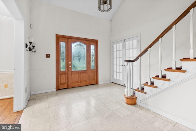 foyer with vaulted ceiling and french doors