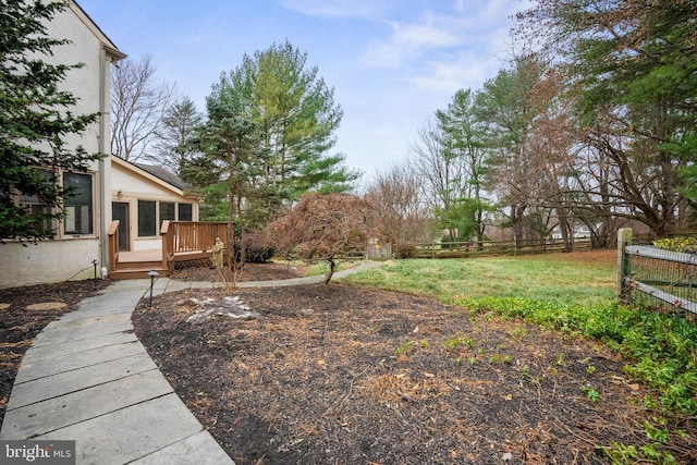 view of yard featuring a wooden deck