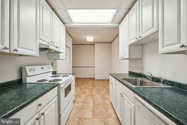 kitchen with sink, white appliances, white cabinets, and light tile patterned floors