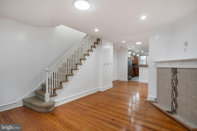 staircase featuring hardwood / wood-style floors