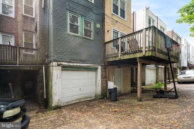 back of house with a garage