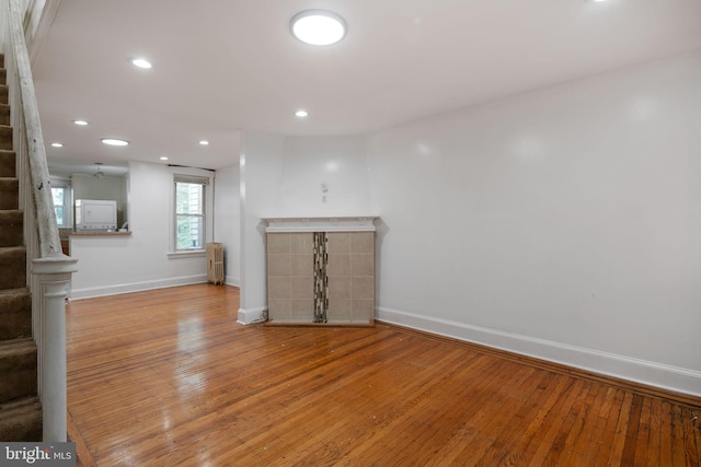 unfurnished living room featuring light hardwood / wood-style floors