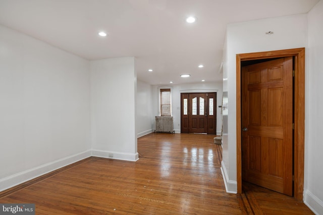 entryway featuring light hardwood / wood-style flooring and radiator