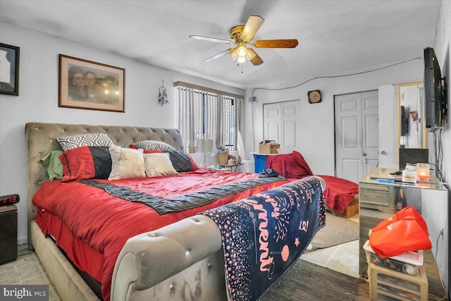 bedroom with multiple closets and ceiling fan