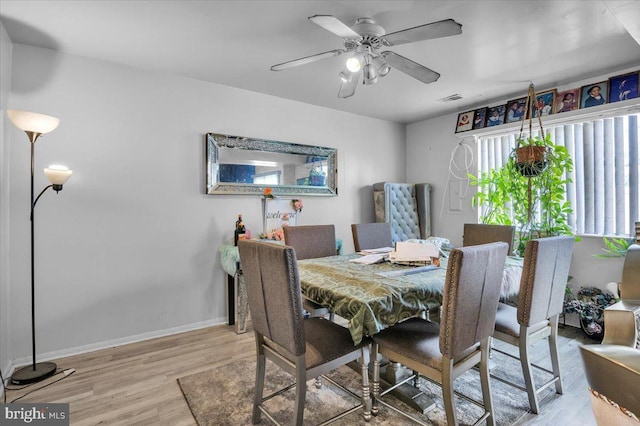 dining area featuring light hardwood / wood-style flooring and ceiling fan