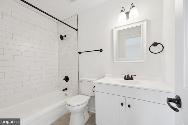 full bathroom featuring tile patterned floors, tiled shower / bath combo, vanity, and toilet