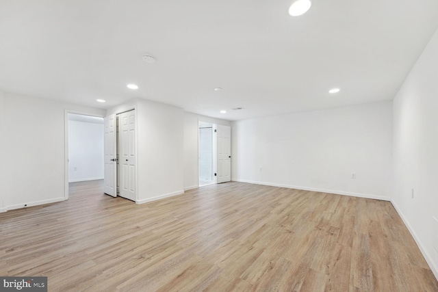 spare room with light wood-type flooring