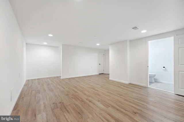 unfurnished room with light hardwood / wood-style flooring