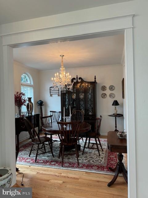 dining space featuring a notable chandelier and hardwood / wood-style floors