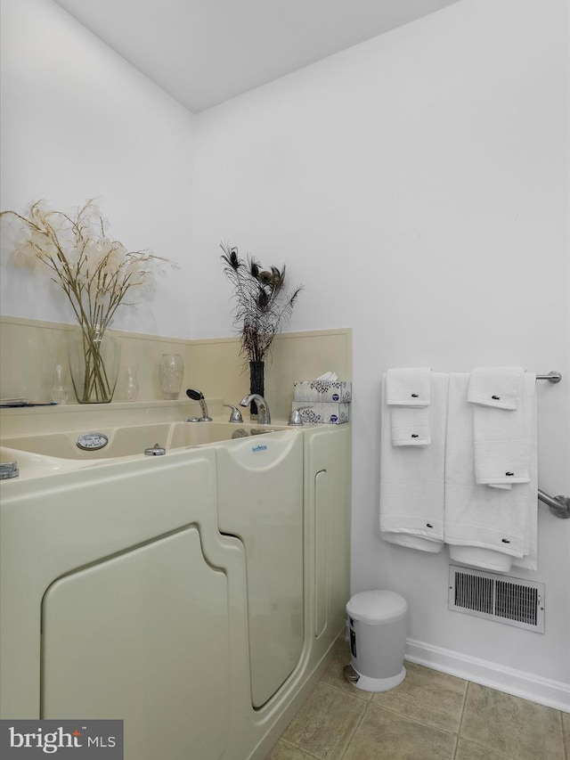 bathroom with tile patterned flooring