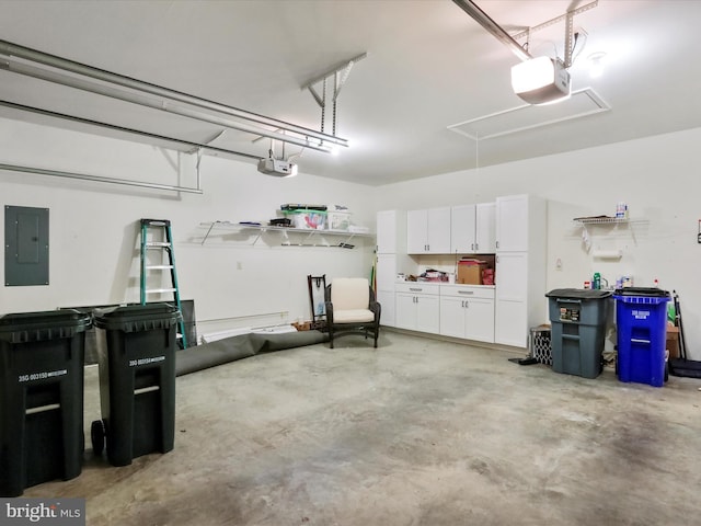 garage with electric panel and a garage door opener