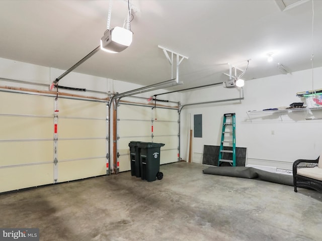 garage with electric panel and a garage door opener