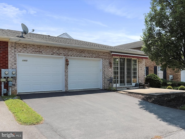 ranch-style home with a garage