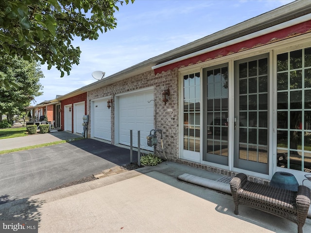 view of side of property with a garage