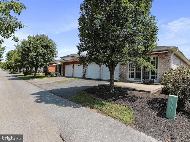 obstructed view of property featuring a garage