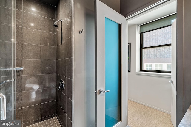 bathroom with tiled shower