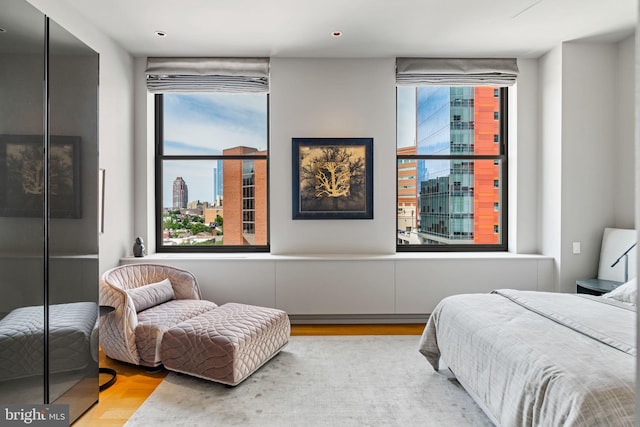 bedroom with light parquet floors