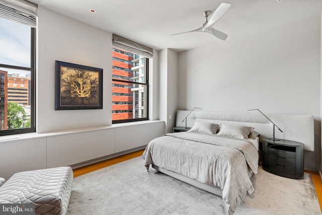 bedroom featuring ceiling fan and hardwood / wood-style flooring