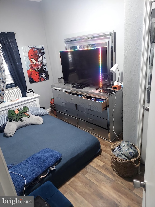 bedroom featuring hardwood / wood-style flooring