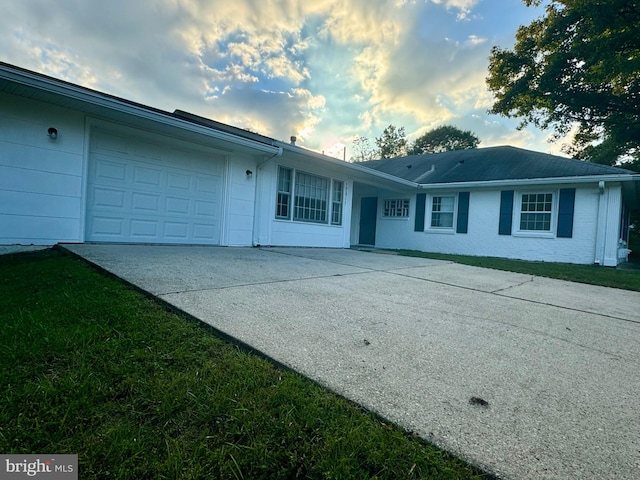 single story home featuring a garage