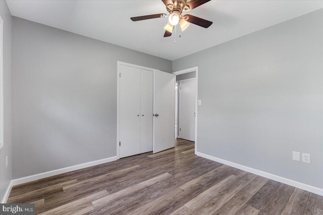 unfurnished room with ceiling fan and hardwood / wood-style flooring