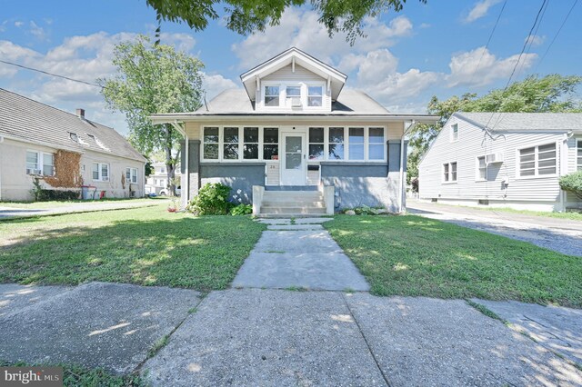 bungalow with a front lawn