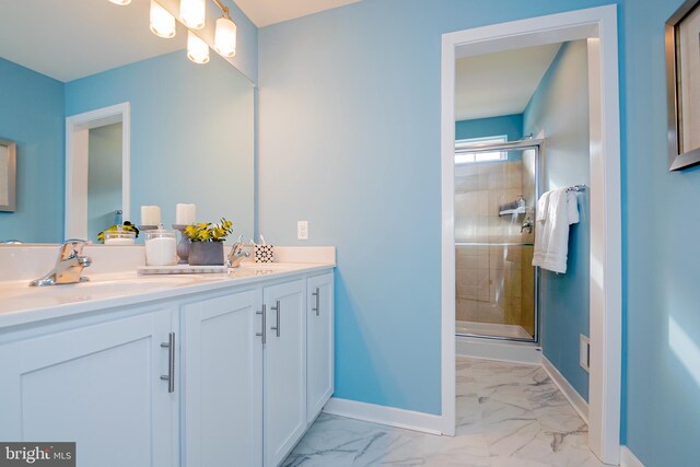 bathroom with double sink vanity, an enclosed shower, and tile patterned floors