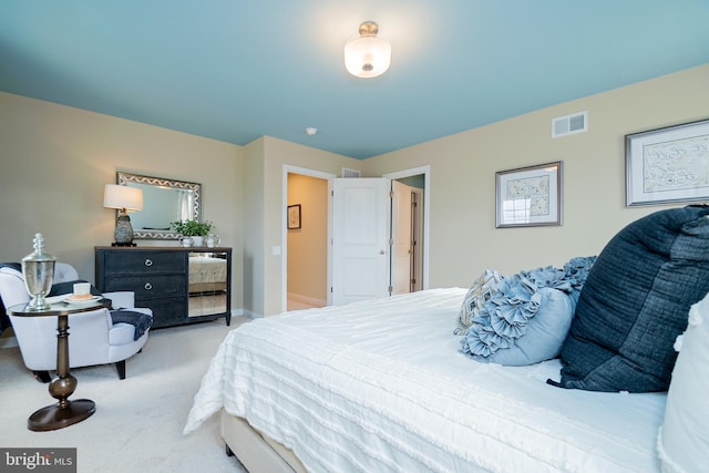 bedroom with light colored carpet