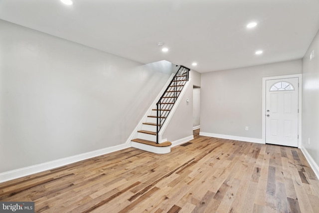 foyer entrance with light hardwood / wood-style floors