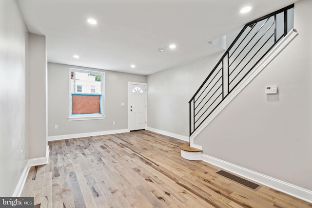 entryway with light hardwood / wood-style floors