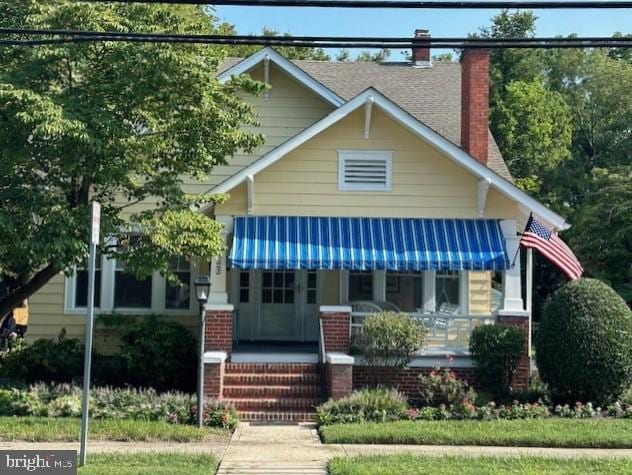 view of front of home featuring covered porch