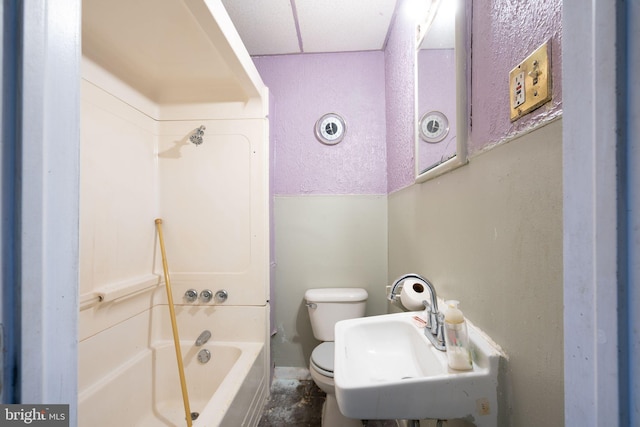 full bathroom featuring bathtub / shower combination, sink, and toilet