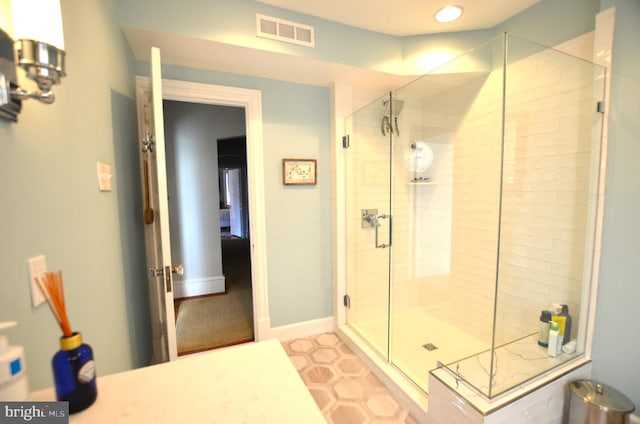 bathroom featuring walk in shower and tile patterned flooring