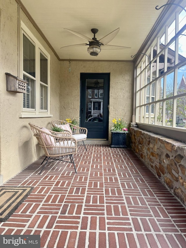 entrance to property featuring ceiling fan