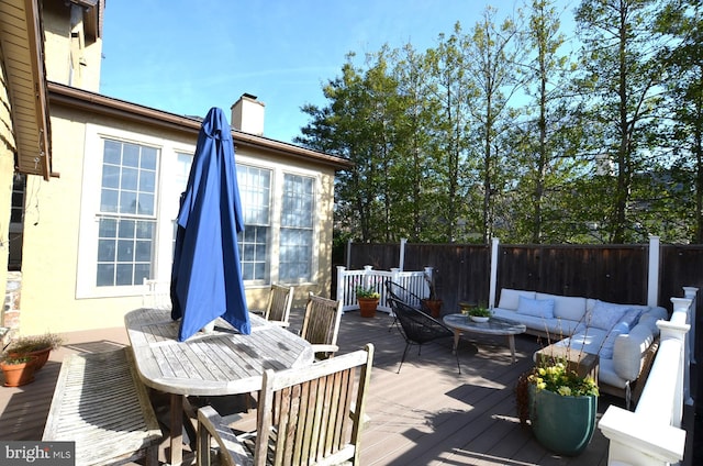 deck with an outdoor hangout area