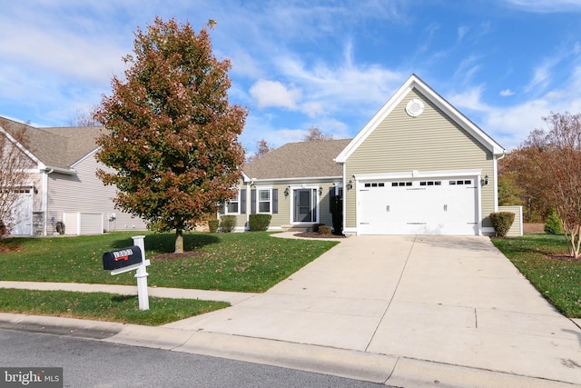 view of front facade featuring a front lawn and a garage