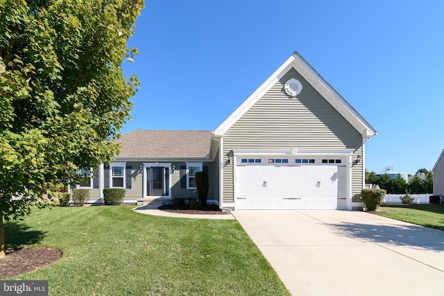 view of front of home with a garage and a front lawn