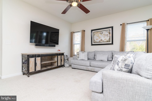 living room with carpet, plenty of natural light, and ceiling fan