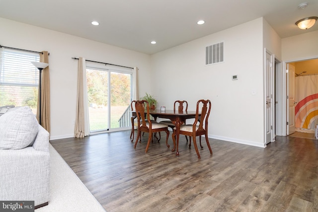 dining room with dark wood-type flooring