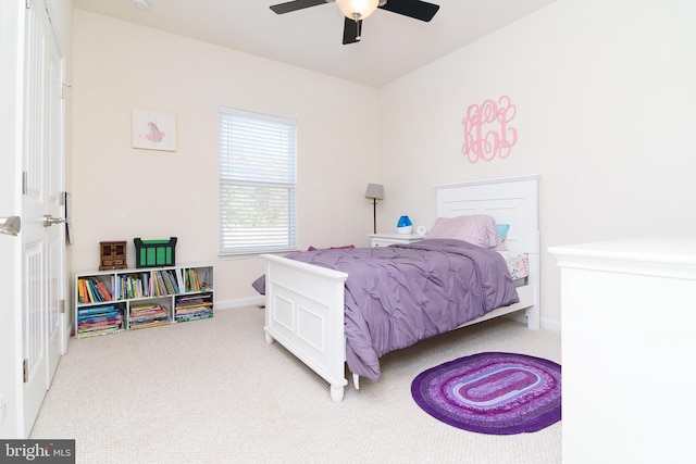 bedroom with light carpet and ceiling fan