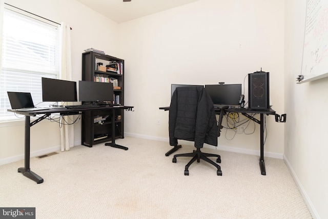 carpeted home office featuring a healthy amount of sunlight