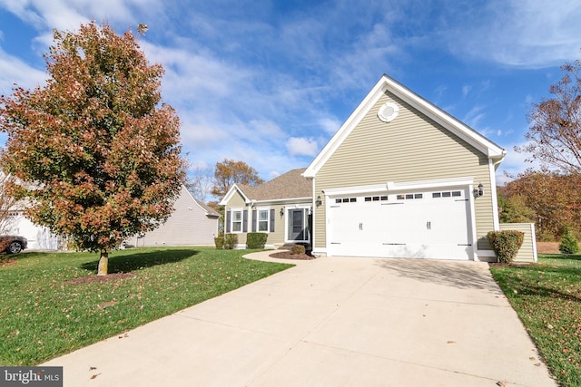 view of front property featuring a front yard and a garage