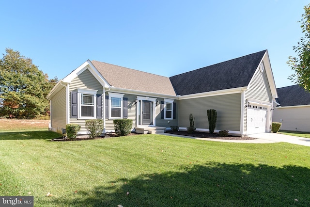 view of front facade with a garage and a front lawn