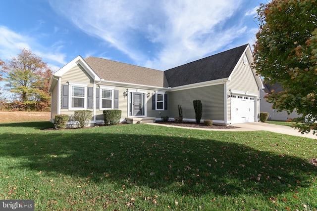 view of front of house featuring a garage and a front lawn