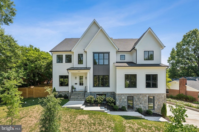 modern farmhouse featuring a front lawn