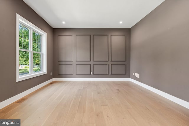 unfurnished room featuring light wood-type flooring