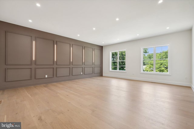 unfurnished living room featuring light hardwood / wood-style flooring